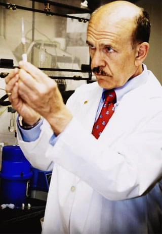 Formulation scientist inspecting a sample in a laboratory