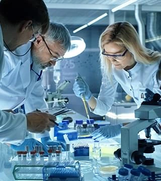 Research team analysing ingredient samples in a laboratory